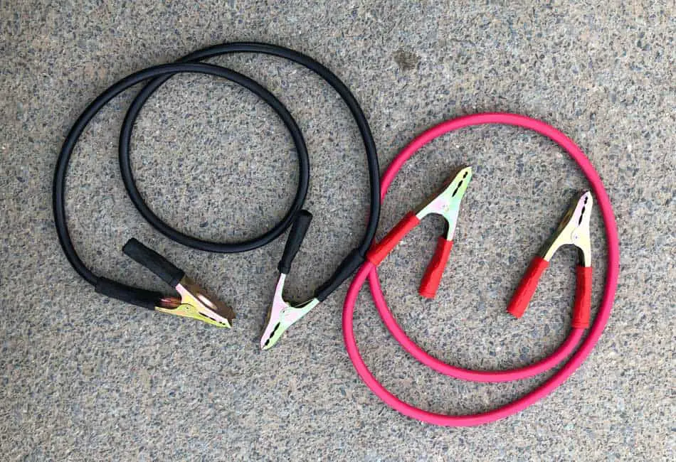 jumper cables untangled on the ground